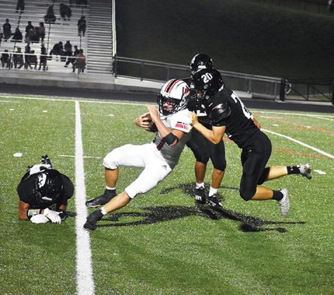 Photos by Justin Fitzgerald/sports@cherokeescout.com Andrews’ Samuel Preston fights for extra yards after catching a pass during the Wildcats’ 52-6 win over the Black Hawks on the road Friday night.