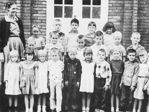 Ruth S. Pullium’s second-grade class picture in 1958 was taken in front of the old brick elementary school in Andrews.