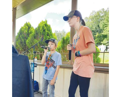 Siblings Mollie and Timothy Hull enjoy praising God through music at Fields of the Wood on Aug. 27.