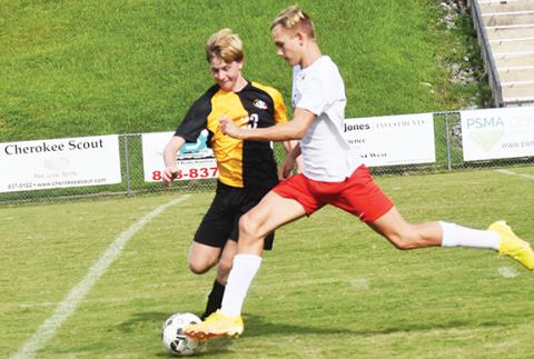 Justin Fitzgerald/sports@cherokeescout.com Murphy’s Harper Martin tries to cut off Pisgah’s Andrew Hardin during the Bulldogs’ 9-0 loss to the Black Bears on Aug. 30.