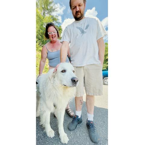 Randy Foster/news@grahamstar.com Katlyn (left) and Mike Eddings have been in a dispute over their Great Pyrenees Leo, over allegations of constant barking that disturbs their neighbors. The case attracted regional attention when a former assistant district attorney proposed dropping the charges in exchange for Leo’s vocal cords being removed. The case was dropped last week.