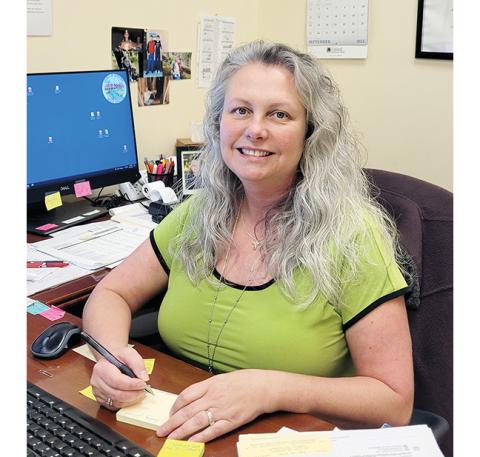 Abigail Blythe Batton/Staff Correspondent Teresa Ricks enjoys her job as a public servant in the capacity of Cherokee County tax assessor.