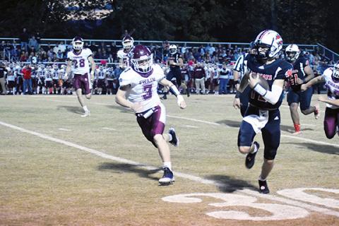 Justin Fitzgerald/sports@cherokeescout.com Andrews Donovan Bateman scrambles to pick up a first down, and more, during the Wildcats’ 33-7 win over Swain County on Friday. Bateman returned an interception for a touchdown as well as ran for a touchdown in the win.