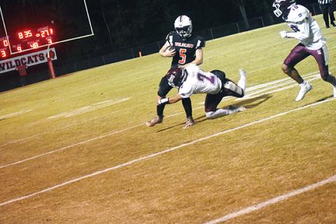 Justin Fitzgerald/sports@cherokeescout.com Andrews’ Austin Martin tries to shake off Swain County’s Gabe Lillard during the Wildcats’ 33-7 win over the Maroon Devils on Oct. 7. In Friday night’s 42-21 win at Cherokee, Martin ran for a 93-yard touchdown.