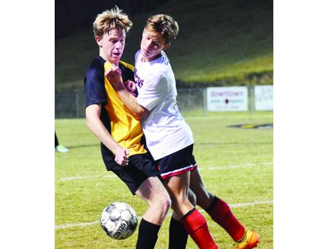 Justin Fitzgerald/ sports@cherokeescout.com Murphy’s Harper Martin and Andrews O’Malley Salinas collide while going for the ball during the Bulldogs’ 6-1 win over the Wildcats on Oct. 3.