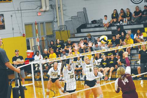 Justin Fitzgerald/sports@cherokeescout.com Murphy’s Addie Johnson (13) and Julia Dockery (8) try to block Swain County’s Rylee Rawls during the Lady Bulldogs’ four-set win over the Lady Devils on Thursday.
