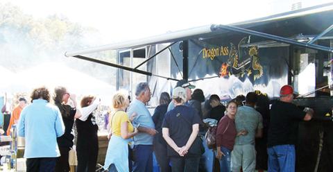 Deby Jo Ferguson/Clay County Progress In addition to the flying pumpkins, another highlight of the event is the variety of food. Big crowds brought long lines for hot dogs, drinks, barbecue, funnel cakes, spiraled whole fried potatoes and a variety of other fare.