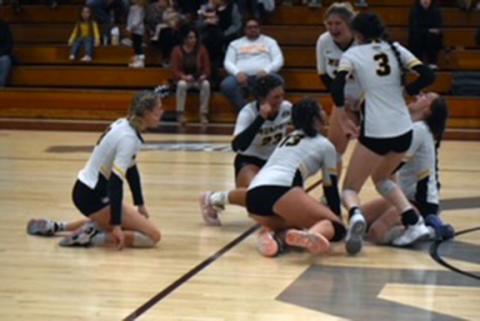 Murphy volleyball celebrates after the final point of a five set win over Robbinsville in the Big Smoky Mountain Conference Tournament championship on Oct. 19
