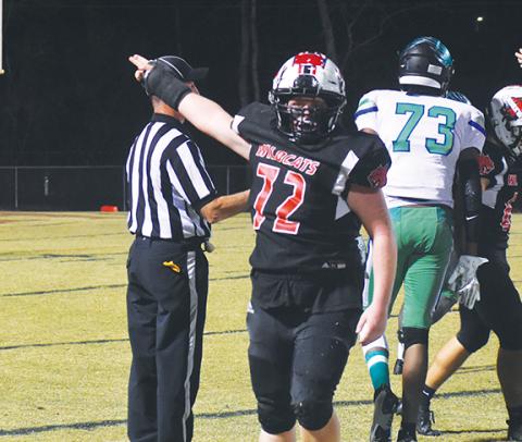 Photos by Justin Fitzgerald/sports@cherokeescout.com Andrews’ Taylor Waldroup signals it’s Wildcats ball after a fumble recovery during Andrews’ 35-0 win over Mountain Island Charter in the second round of the state 1A playoffs Thursday.