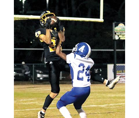Photos by Jared Putnam/editor@cherokeescout.com Murphy’s Cameron Grooms hauls in a 38-yard pass over Albemarle cornerback Christian Harris during the opening round of the state 1A playoffs on Friday at David Gentry Field.