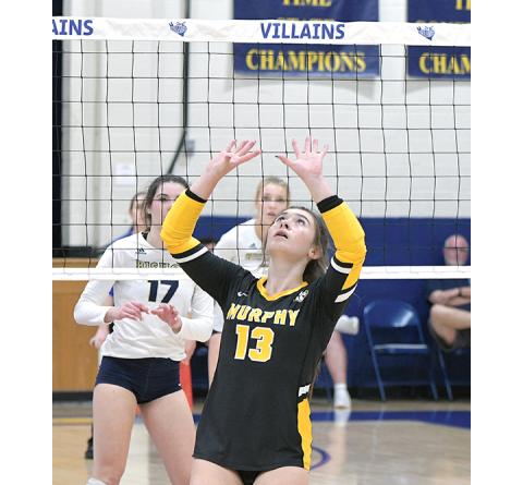 Michael Lindsay/High Point Enterprise Murphy’s Addie Johnson looks to set the ball during the Lady Bulldogs’ 3-0 loss to Bishop McGuinness in the third round of the state playoffs Thursday. Murphy finished the season with a 23-4 record.