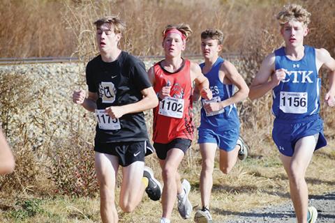 Justin Fitzgerald/sports@cherokeescout.com Andrews O’Malley Salinas (in red) took first in the 1A West Regional Championship on Saturday. Salinas will run again during this Saturday’s state meet, as will Hiwassee Dam’s Ethan Russell, who is just behind Salinas at this point in the race.