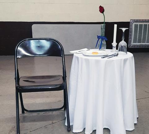 Photos by Anngee Quinones-Belian/Staff Correspondent  A single table, chair and place setting sits alone in honor of fallen first responders. 