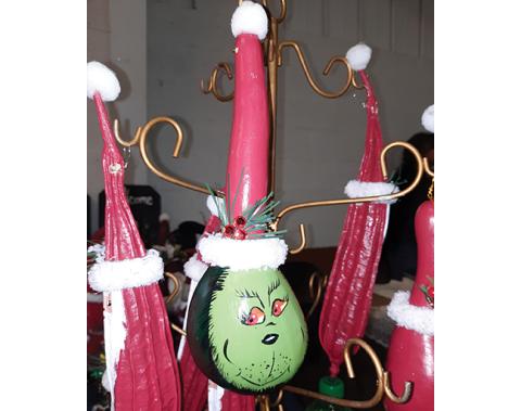 Photos by Anngee Quinones-Belian/Staff Correspondent Grinch ornaments were just one of the many items available at the Peachtree Community Center Holiday Arts & Crafts Festival on Saturday. 