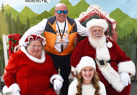 Andrews Police Chief Rocky Burrell and daughter Trista visited Santa and Mrs. Claus on Saturday afternoon during Christmas on Main Street. The event went so well that law enforcement could have a good time, too. 