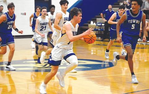 Hiwassee Dam’s Preston Hyde drives to the hoop during the Eagles’ 60-58 win over Towns County on Saturday. Hyde scored 16 points, including the game-winning shot.