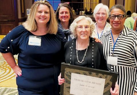 Tri-County Democratic Women member Jane Carver (front, center) had plenty of support when she received the distinguished Trailblazer Award in Greensboro. Front row: Elizabeth Goodwin, Democratic Women of North Carolina President; Carver; and Tri-County Democratic Women President Pat Sherrill. Standing in back are Julia Buckner, a past president of the Democratic Women of North Carolina; and Diane Snyder, Tri-County Democratic Women member.