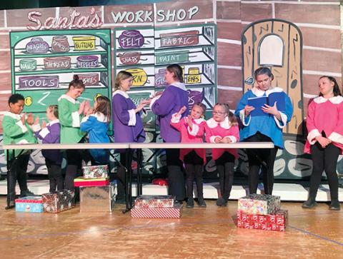 Photos by Abigail Blythe Batton/Staff Correspondent Santa’s elves take a break for games in the toy workshop during the Community Youth Players’ production of Rudolph the Red-Nosed Reindeer Jr.