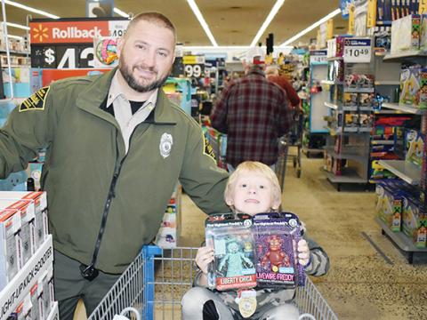 Photos by Bill Belian/Contributing Photographer N.C. Wildlife Officer Carpenter and Bishop were happy to be shopping together.