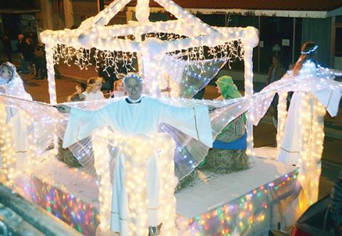 Photos by Abigail Blythe Batton/Staff Correspondent Andrews Seventh-day Adventist Church filled the town’s new parade route with lit angels on a spectacular float Saturday night.