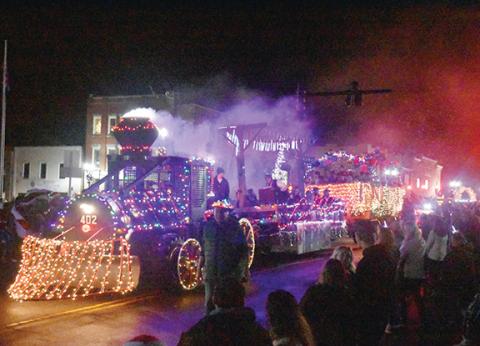 Bill Belian/Contributing Photographer This brightly lit train designed by the folks at Murphy Power Board was a big part of the Murphy Christmas Parade, as it drew cheers when it passed by Saturday.