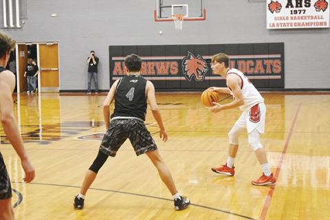 Justin Fitzgerald/sports@cherokeescout.com Andrews Ty Clark tries to get the offense in motion during the Wildcats’ 52-43 loss to Robbinsville on Dec. 20.