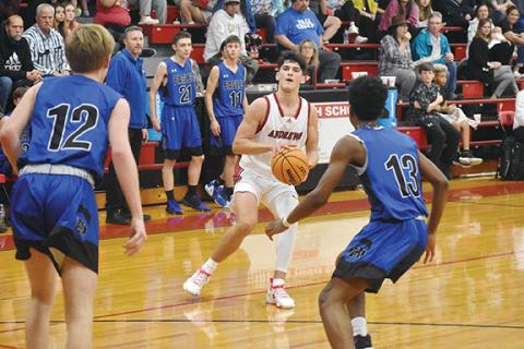 Justin Fitzgerald/sports@cherokeescout.com Andrews senior Donovan Bateman lines up a 3-point shot during the Wildcats’ 64-39 win over Cherokee County rival Hiwassee Dam on Dec. 6.