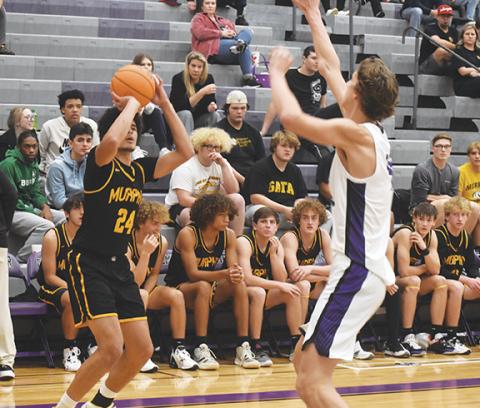 Justin Fitzgerald/sports@cherokeescout.com Murphy’s Dominick Rummler hoists a shot during the Bulldogs’ 91-62 loss at Gilmer County, Ga., on Nov. 29.