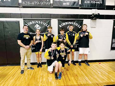 Murphy Wrestling  Murphy Middle School brought home the hardware at the Smoky Mountain Conference championships on Dec. 15. Pictured are (kneeling, from left) Trenton Cook and Zander Lucksavage; (standing, from left) head coach Mike Catuto, Halie Hill, Mason Ray, Anthony Catuto, Jonathan Lamb and Caedan Chastain.