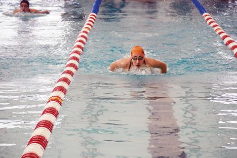 Justin Fitzgerald/sports@cherokeescout.com Tri-County Early College sophomore Ariana Rivas, shown swimming the butterfly, set a new Candy Cane Invitational meet record in the 50-yard freestyle Saturday.