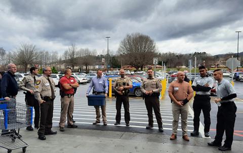 Anngee Quinones-Belian/Staff Correspondent  Law enforcement officers and deputies will again line up in front of Walmart in Murphy this year waiting to be paired with children to go Christmas shopping. 