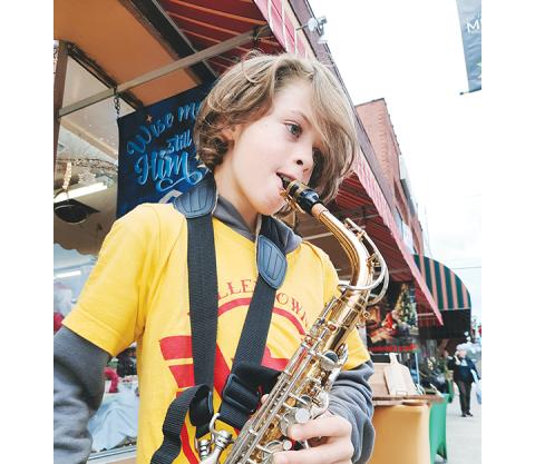 Anngee Quinones-Belian/Staff Correspondent  David Skirvin on Saxophone earlier this month at the Art Walk in downtown Murphy. 