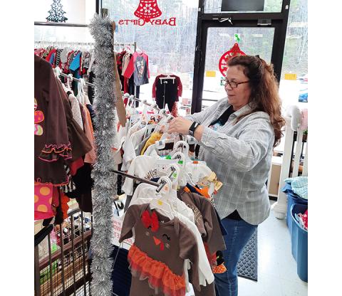 Photos by Anngee Quinones-Belian/Staff Correspondent Wendy Goins keeps her store in Murphy clean, and affordable by taking in good used clothing.