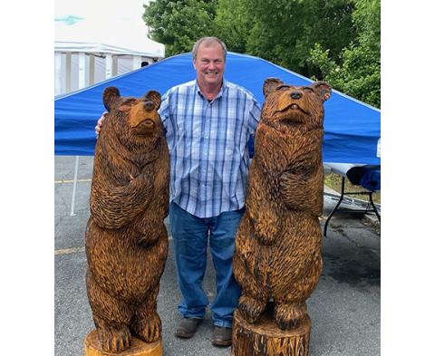 Dan Faber of Wolf Creek uses a chainsaw to create larger items, like his two bears.