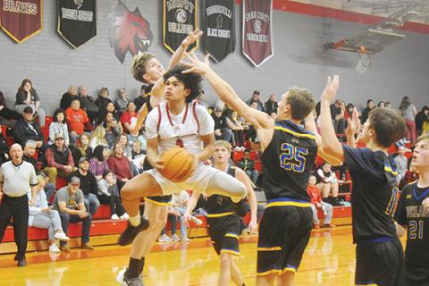 Justin Fitzgerald/sports@cherokeescout.com Andrews’ Kegan Ellis slices through the Highlands defense during the Wildcats’ 72-24 win over the Highlanders on Jan. 17.