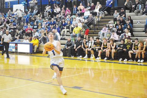 Photos by Justin Fitzgerald/sports@cherokeescout.com The Andrews girls (right) and Hiwassee Dam boys (left) basketball teams both picked up big wins Friday night.