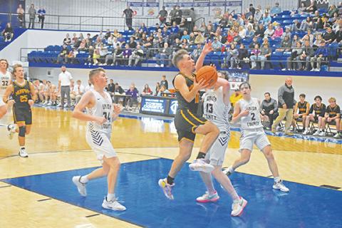 Justin Fitzgerald/sports@cherokeescout.com Murphy’s Dillian Brown takes the ball to the hole during the Bulldogs’ 69-66 loss to Union County, Ga., on Thursday.