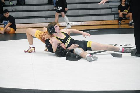 Justin Fitzgerald/sports@cherokeescout.com Murphy’s Zach Kessler looks to the official to see if he’s pinned Cherokee’s Jessie Catolster-Hernandez during the Smoky Mountain Conference Wrestling Championships on Saturday.