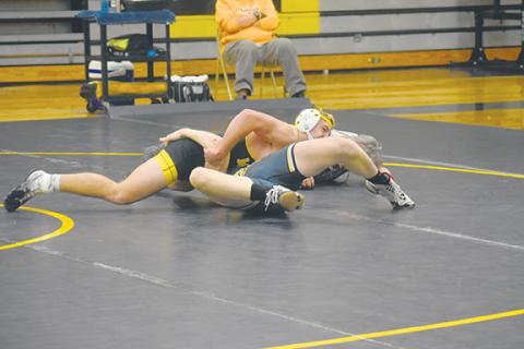 Justin Fitzgerald/sports@cherokeescout.com Murphy’s Mason Cook works to pin his opponent during the Bulldogs’ 52-20 win over Hayesville on Friday – Senior Night.