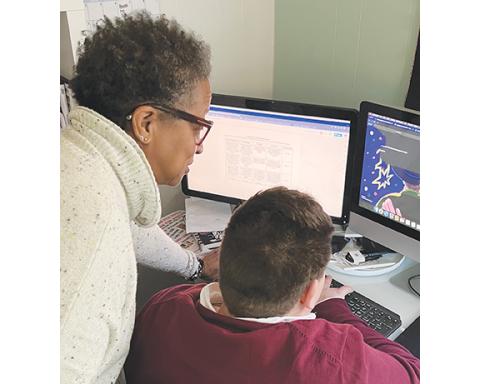 Abigail Blythe Batton/Staff Correspondent Pat Sherrill works with student Eli Kaufman in her quest to educate youth about the power of language.