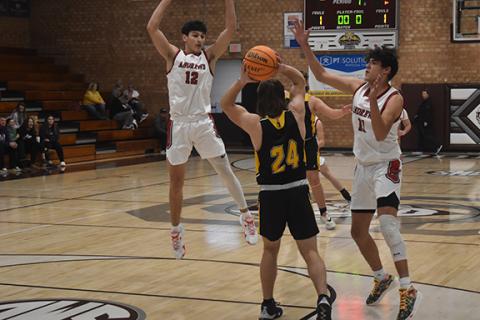 Justin Fitzgerald/sports@cherokeescout.com Andrews Donovan Bateman (left) and Cam Rattler (right) turn up the pressure during the Wildcats’ 71-47 win over Tuscola on Dec. 28.