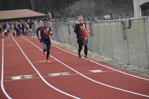 Photos by Justin Fitzgerald/sports@cherokeescout.com Tri-County Early College’s Landon McCoy (left) and Logan DiCicco (right) sprint to the finish line of the boys 55-meter dash of the Swain Polar #3 meet on Jan. 11.