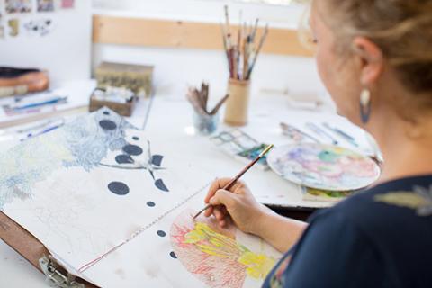 Annie Fain Liden at work on a new watercolor image.