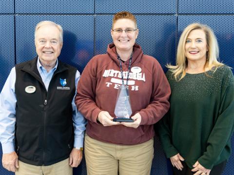 Tina Dellaposta (center) of Murphy was named the 2023 Employee of the Year at North Georgia Technical College. Shown at the award presentation are NGTC President John Wilkinson (left), and Christy Bivins (right), NGTC dean of academic affairs and Employee of the Year coordinator.