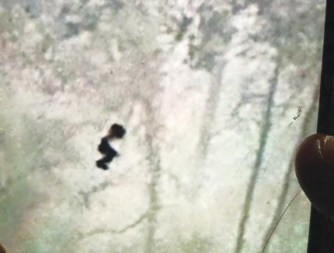 A photo of a drone control screen shows an infrared image of the missing teen late Monday evening.