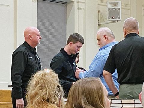 David Brown/dbrown@cherokeescout.com  Brian Crisp is led away in handcuffs by law enforcement officers on Feb. 15 after being convicted of killing Kenneth Jones at the Cherokee County Courthouse in Murphy.