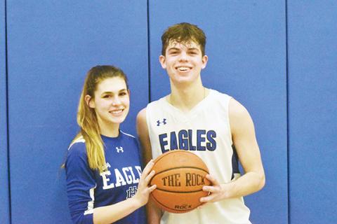 Justin Fitzgerald/sports@cherokeescout.com Hiwassee Dam seniors Kiera Taylor (left) and Preston Hyde (right) both scored their 1,000th career point during the Little Smoky Mountain Conference Tournament.