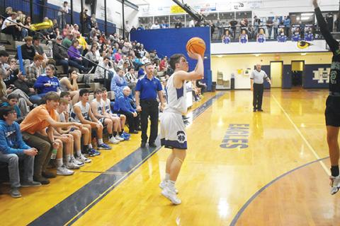 Justin Fitzgerald/sports@cherokeescout.com Hiwassee Dam’s Preston Hyde spots up for a 3-pointer during the Eagles’ 92-32 win over Blue Ridge on Thursday. Hyde had 37 points in the win, and he has scored a total of 972 for his career.