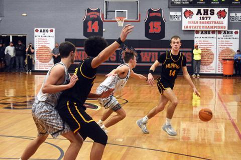 Justin Fitzgerald/sports@cherokeescout.com Murphy’s Cole Laney looks for an opening in the Robbinsville defense during the Bulldogs’ 63-52 loss to the Black Knights in the Big Smoky Mountain Conference Tournament championship on Friday.