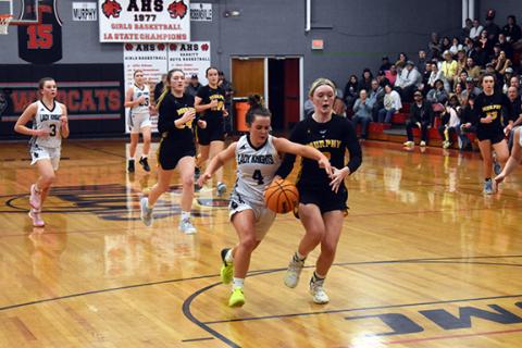 Justin Fitzgerald/sports@cherokeescout.com Murphy’s Lochlan Rogers is caught from behind by Robbinsville’s Desta Trammell in the Lady Bulldogs’ 76-69 loss to the Lady Knights on Feb. 14.